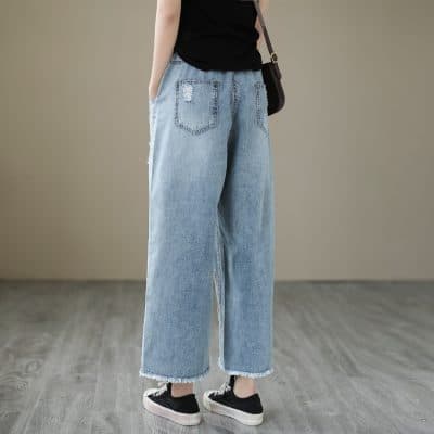 Casual women's wide-leg distressed denim for comfortable, stylish wear, perfect for everyday fashion and urban looks.