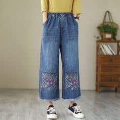 Comfortable women's wide-leg denim with colorful embroidery detail, perfect for casual and trendy outfits.