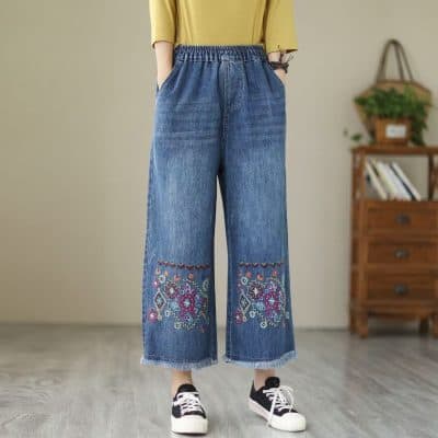 Comfortable women's wide-leg denim with colorful embroidery detail, perfect for casual and trendy outfits.