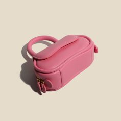Pink leather eye care storage case for contact lenses and accessories, portable and stylish. Ideal for storing eye products securely and conveniently.