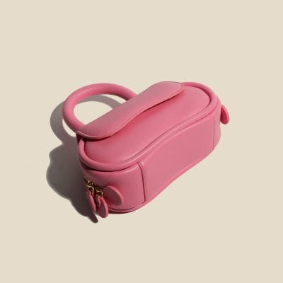Pink leather eye care storage case for contact lenses and accessories, portable and stylish. Ideal for storing eye products securely and conveniently.