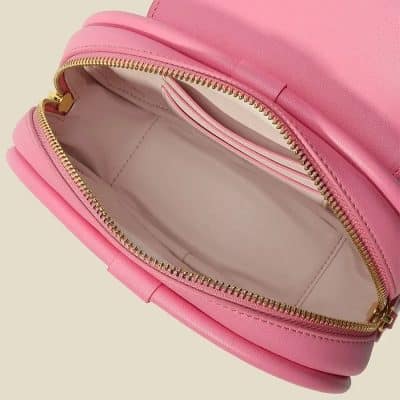 Pink makeup bag with gold zipper, spacious interior with card slot, ideal for cosmetics, skincare, and accessories, perfect for travel, organization, and stylish storage.
