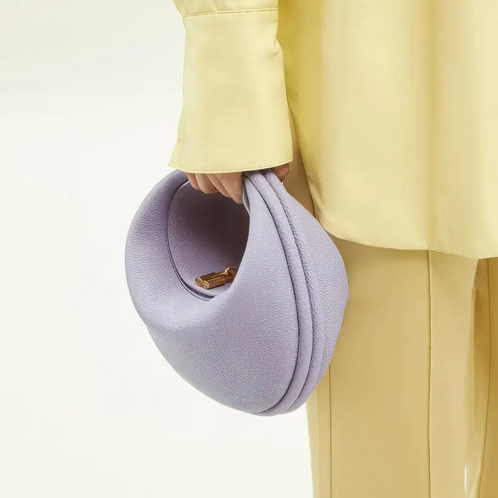 Stylish grey handbag with a sleek design, perfect for daily use and special occasions. Features high-quality leather and gold-tone hardware, adding a touch of luxury to your outfit.