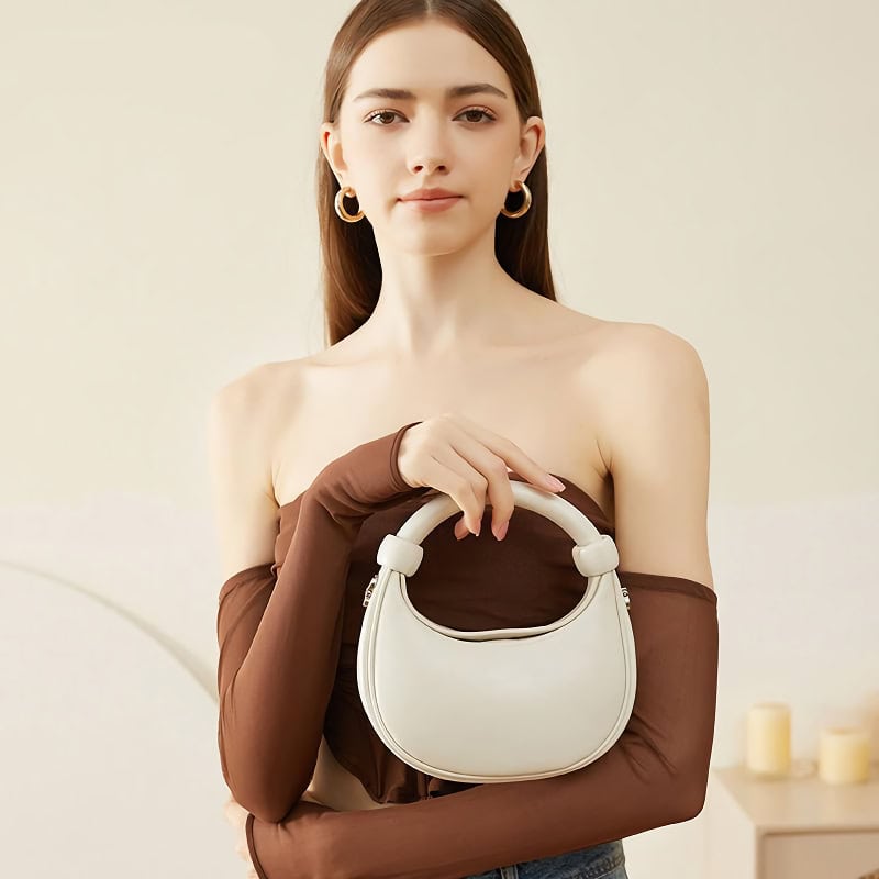 Stylish white handbag for women, perfect for fashion-forward accessories. Crafted for versatile everyday use, blends chic design with functionality, ideal for enhancing any outfit.