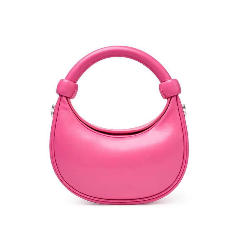Stylish pink handbag with unique circular handle, perfect for fashion-forward accessories. Ideal for women seeking trendy, elegant, and durable bags for daily use or special occasions.