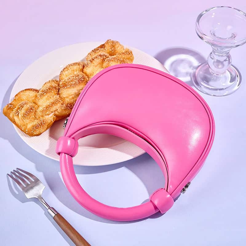 Pink leather optical case with handle.