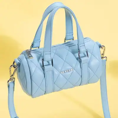 Chic blue designer handbag perfect for fashion-forward women, made with high-quality materials, featuring a quilted pattern, sturdy handles, and versatile strap for day-to-night use.