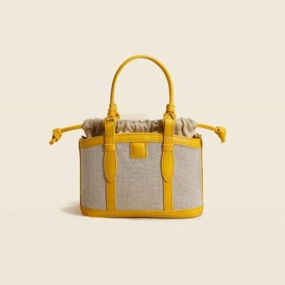 Bright yellow and beige tote bag with durable fabric, ideal for everyday shopping, casual outings, and stylish accessories, combining fashion and functionality.