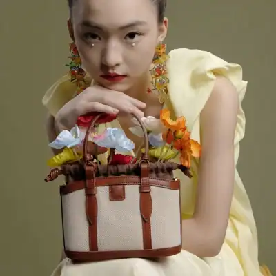 Elegant handbag with floral accessories for women, perfect for fashion-forward accessories shopping at Monalisa Store.