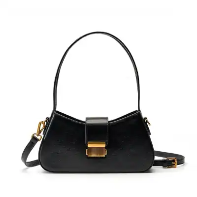 Elegant black leather handbag with gold hardware, perfect for stylish accessories. Compact and versatile for day or evening use.