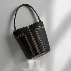 Stylish black leather handbag with orange and white stitching, perfect for fashion-conscious women. Durable, high-quality material with spacious interior for daily essentials.