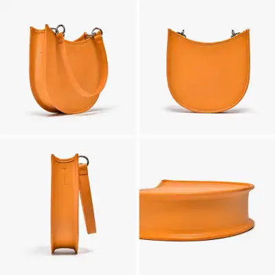 Orange leather crescent-shaped bag with silver hardware, stylish and modern design. Perfect for fashion-forward individuals seeking a unique accessory.