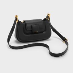 Elegant black leather handbag with gold accents, perfect for fashion-forward styles. Features a sleek design with a spacious interior, ideal for daily or evening wear.
