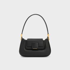 Stylish black handbag with a top handle and gold hardware, ideal for fashionable eyewear and accessories from Monalisa Medical.