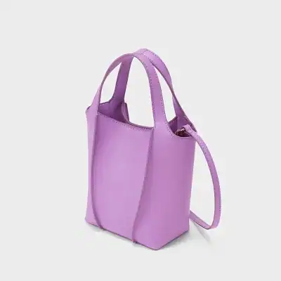 Stylish purple mini tote bag with top handles and an adjustable strap, perfect for casual and elegant occasions. Made with premium materials, offering both fashion and functionality.
