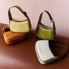 A collection of vibrant leather handbags with modern design from Monalisa Store, featuring multiple colors and sleek styles suitable for fashion-conscious shoppers seeking premium quality accessories.