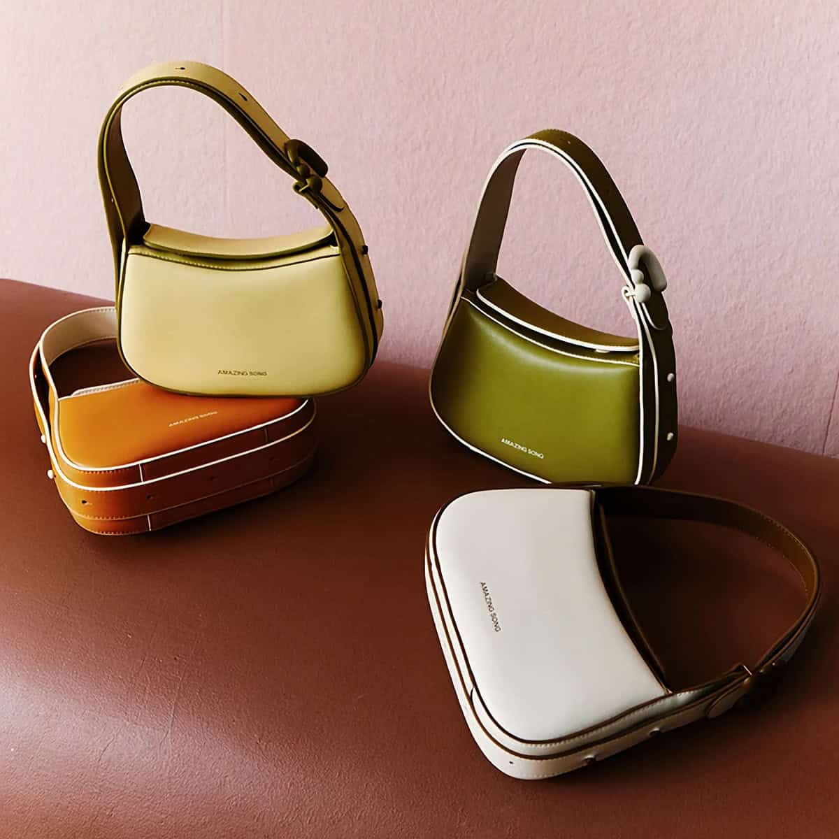 A collection of vibrant leather handbags with modern design from Monalisa Store, featuring multiple colors and sleek styles suitable for fashion-conscious shoppers seeking premium quality accessories.