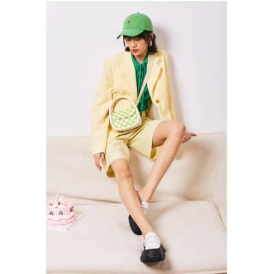 Stylish woman wearing trendy outfit with accessories from Monalisa Store, perfect for contemporary fashion and optical accessories.