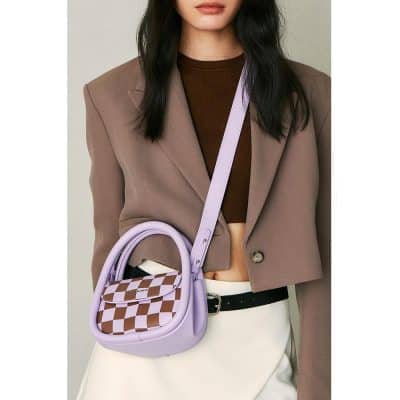 Lavender crossbody bag with checkered pattern, stylish accessory perfect for casual outings and fashionistas, combining functional design with trendy aesthetics for versatile wear.