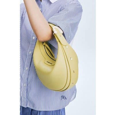 Stylish yellow handbag for women, perfect for fashion-forward accessories and everyday use. Crafted from high-quality leather, lightweight, and versatile for any outfit.