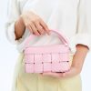 Handmade pink fashion handbag with woven design, perfect for casual and formal occasions. Durable material and stylish look suitable for everyday use.