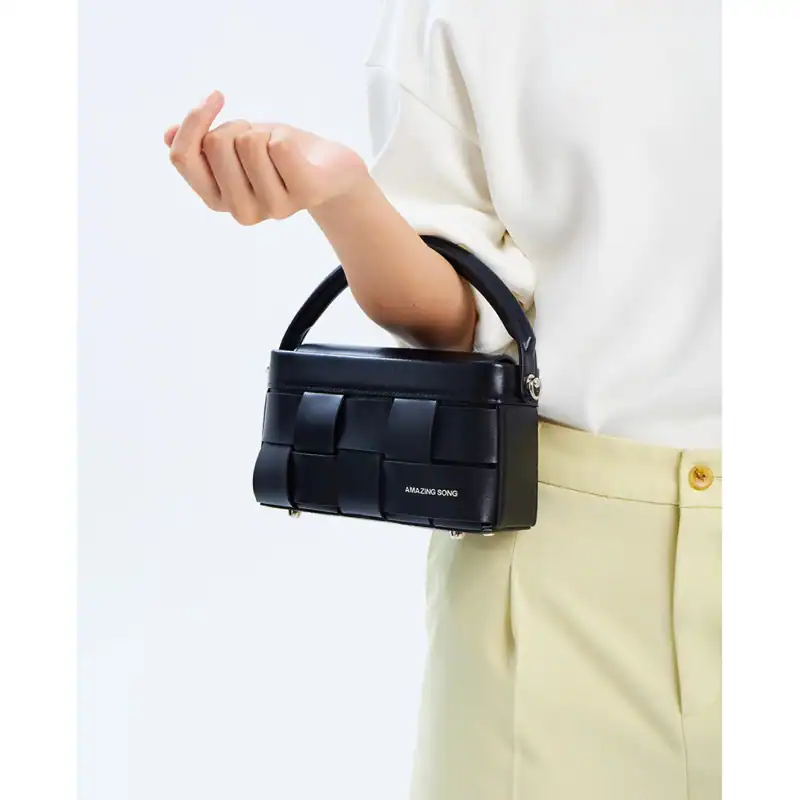 Stylish black handbag with a modern design, perfect for fashion-forward accessories and everyday use. Features a sleek finish and compact size for versatile styling.