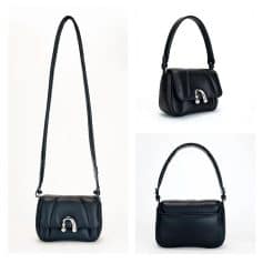 Elegant black leather handbag with silver clasp, perfect for fashion-forward accessories. Suitable for daily use or special occasions.