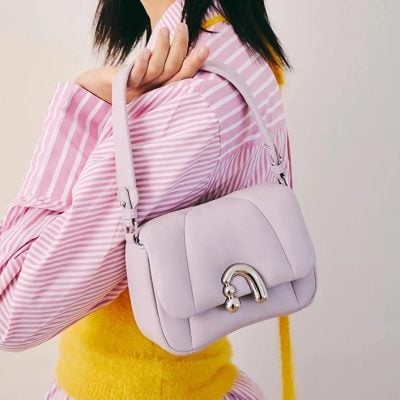 Stylish pink handbag with silver hardware, perfect for fashion-forward accessories. Ideal for daily use or special occasions, enhancing your overall look.