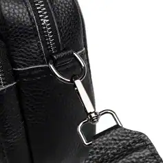 High-quality black leather handbag with durable zipper and metal clasp, perfect for fashion-forward individuals seeking elegant accessories.