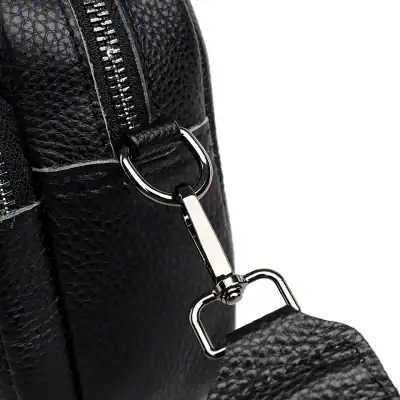 High-quality black leather handbag with durable zipper and metal clasp, perfect for fashion-forward individuals seeking elegant accessories.