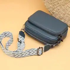 Stylish navy blue leather crossbody bag with adjustable patterned strap for women. Perfect for daily use, travel, and casual outings. Enhance your look with a versatile accessory from Monalisa Store.