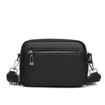 Stylish black leather crossbody bag with front zipper pocket, adjustable strap, perfect for everyday use or accessories. Durable, lightweight, and versatile for fashion-forward individuals.