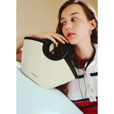 A trendy optical bag from Monalisa Store designed for easy and elegant eyewear storage, perfect for fashion-conscious individuals seeking practicality and style.