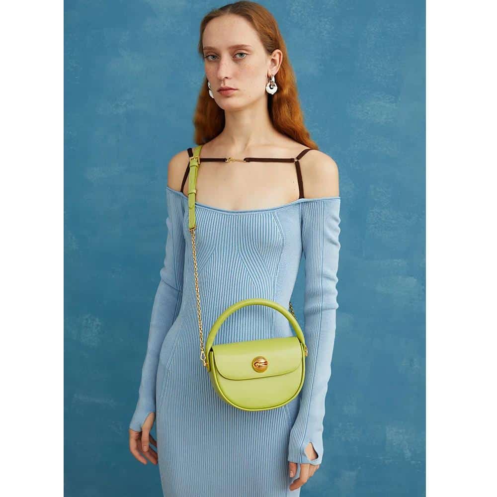 Stylish lime green crossbody purse featuring a sleek gold clasp, perfect for fashion-forward accessories. Ideal for casual or elegant outfits, offering a modern twist on essential jewelry and handbag trends.