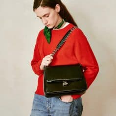 Elegant black leather handbag with chain strap, perfect for fashion-forward women looking for stylish accessories.