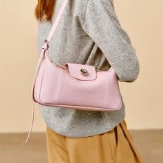 Stylish pink leather handbag with gold hardware, perfect for daily use and elegant outings, available at Monalisa Store.