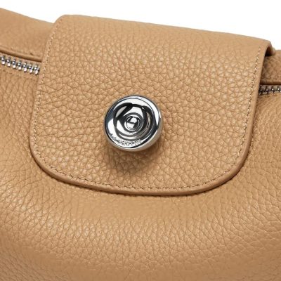 Luxurious beige leather handbag featuring textured material and a stylish metallic button closure, ideal for fashion lovers. Shop premium leather bags at Monalisa Store for timeless style.