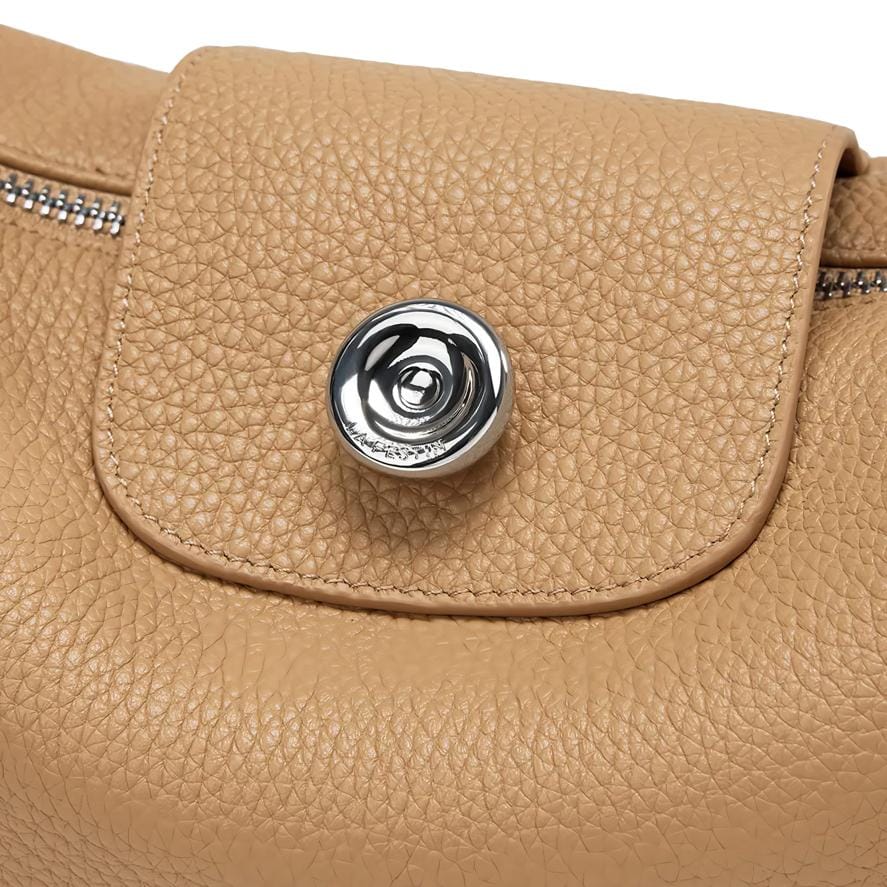 Luxurious beige leather handbag featuring textured material and a stylish metallic button closure, ideal for fashion lovers. Shop premium leather bags at Monalisa Store for timeless style.