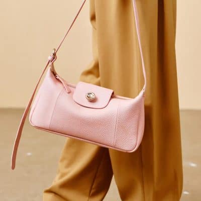 Elegant pink leather handbag with adjustable strap, perfect for fashion-forward accessories at Monalisa Store.
