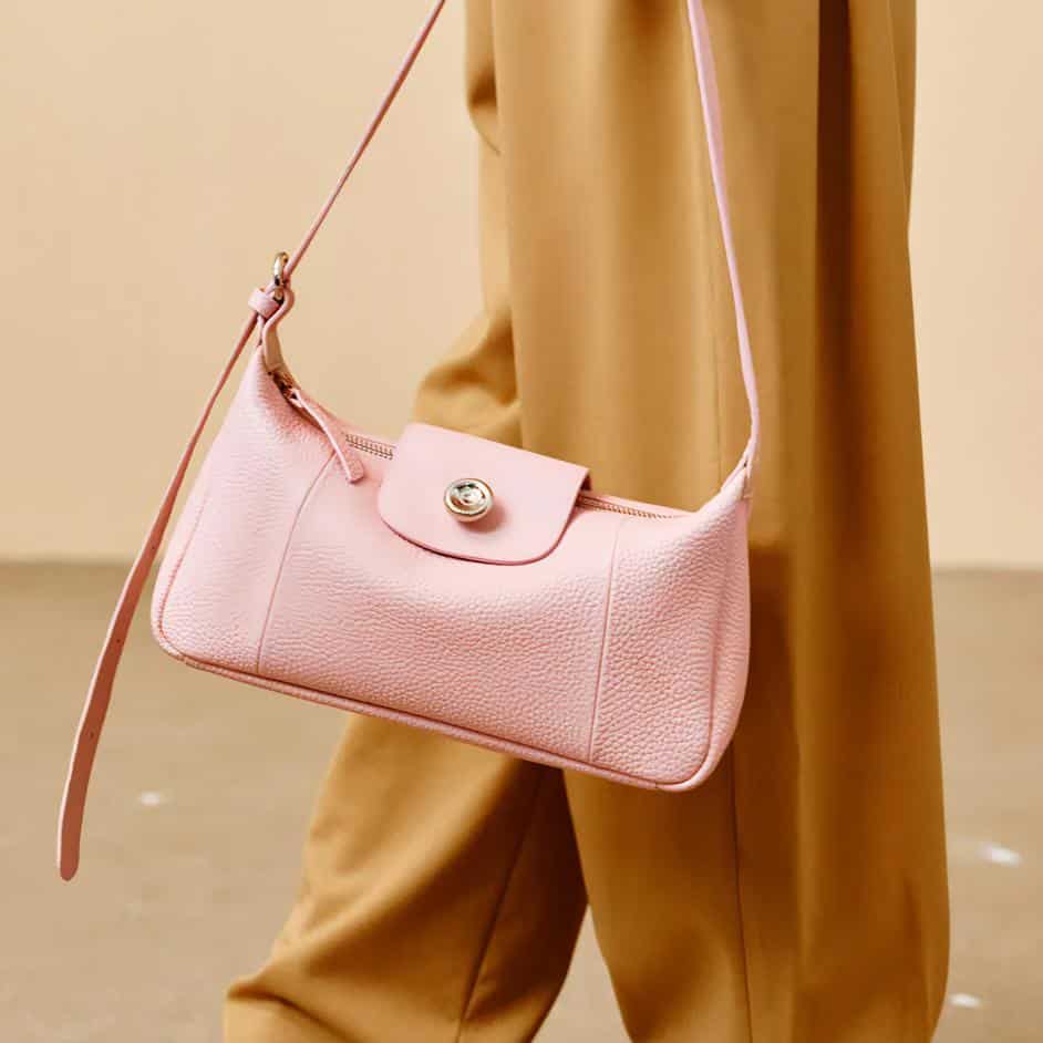 Elegant pink leather handbag with adjustable strap, perfect for fashion-forward accessories at Monalisa Store.