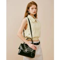 High-quality black leather shoulder bag with silver hardware, perfect for fashion-forward women seeking luxury accessories. Elegant and versatile for everyday use.