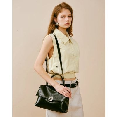 High-quality black leather shoulder bag with silver hardware, perfect for fashion-forward women seeking luxury accessories. Elegant and versatile for everyday use.