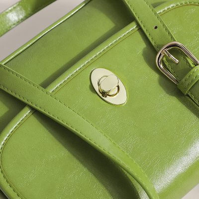 Stylish green handbag with gold hardware, perfect for fashion-forward accessories. Perfect for enhancing any outfit and ideal for everyday use or special occasions.