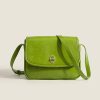 Bright green stylish leather bag for women and men, perfect for fashion accessories and everyday use, featuring adjustable strap and secure clasp.