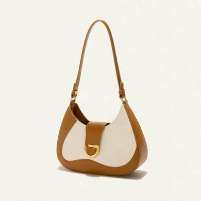 Elegant leather handbag perfect for women’s fashion, combining beige and brown tones with gold hardware for a sophisticated look. Ideal for daily use and special occasions.