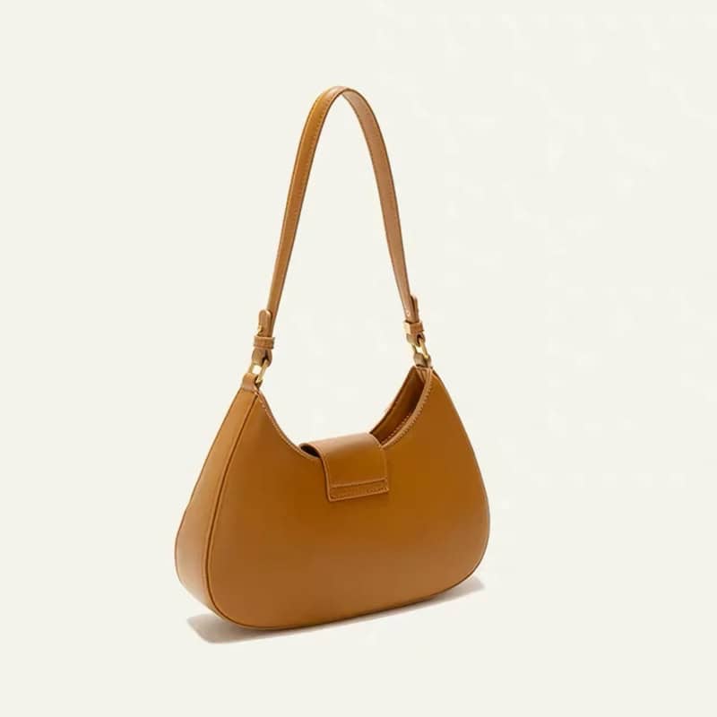 High-quality tan leather handbag with adjustable strap, perfect for daily use or stylish outings. Durable, fashionable, and versatile accessory for women.