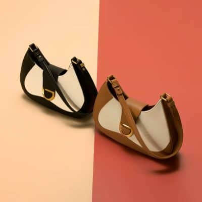 Stylish designer handbags with elegant leather straps, metal hardware, and modern aesthetic from Monalisa Store. Perfect for fashion-forward accessories and luxury handbag shoppers.