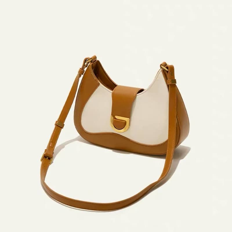 Stylish brown and beige leather handbag for women, perfect for everyday use and fashion-forward outfits. High-quality materials and trendy design make it a must-have accessory.