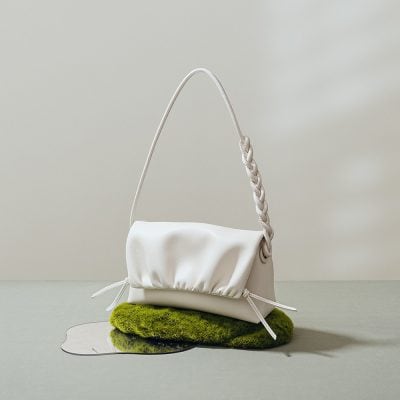 Versatile white handbag with a braided strap, stylish design, perfect for daily wear and special occasions. Crafted from high-quality materials for durability and a sleek look.