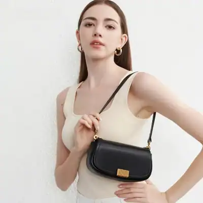 Elegant black handbag with gold accent for women, perfect for fashion accessories and daily use.